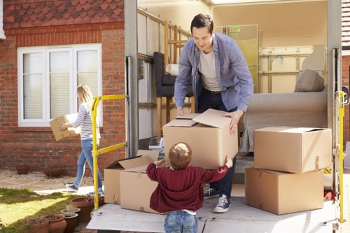 House removalists helping a Finchley home move with boxes and furniture