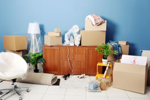 Packed moving boxes and furniture ready for transport