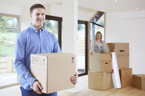 Packed moving boxes ready for transport in a Finchley property