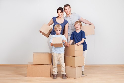 Man and van removals team helping a Finchley household move boxes