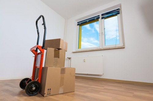 Careful unpacking of household items into a new home in Finchley