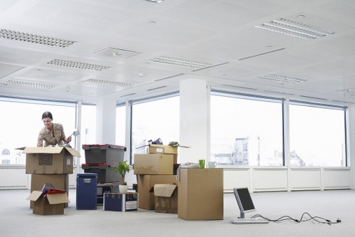 Packed boxes and furniture ready for loading into a moving truck