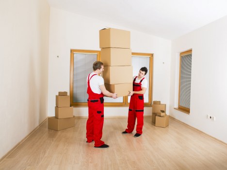 Worker demonstrating careful lifting and safe handling techniques