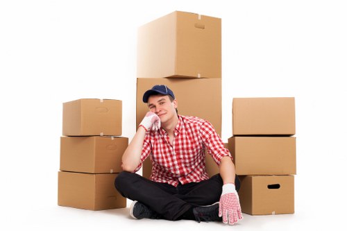 Packed office boxes and furniture ready for transport in Finchley